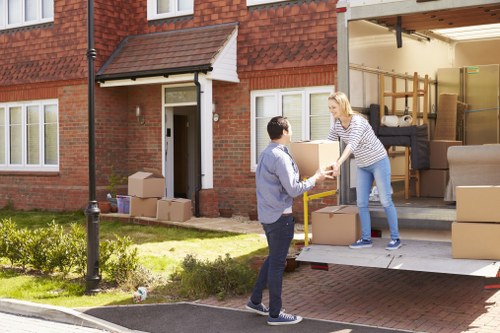 Professional moving team handling boxes and furniture for a South Kensington same day relocation