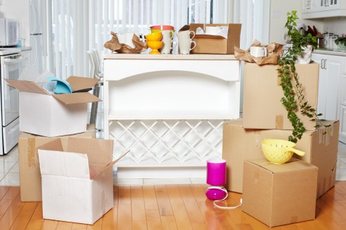 Packed office equipment prepared for commercial moves in South Kensington