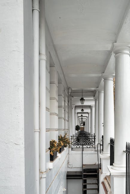 A rectangular white metal street sign mounted on a red-brown brick wall with a rough texture. The sign features the text 'WELCOME TO SOUTH KENSINGTON' in large black uppercase letters, with smaller re